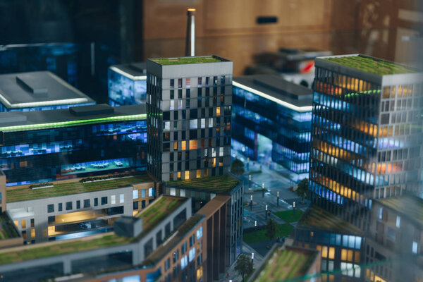 Close-up shot of miniature model of modern city with skyscrapers