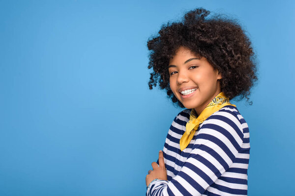 cheerful african american young girl, isolated on blue