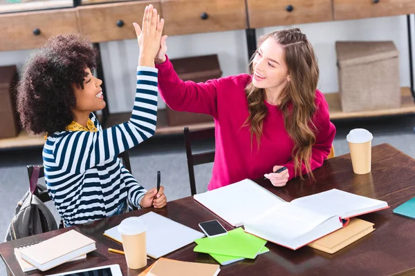 Smiling Multiethnic Students Giving High Five Each Other While Studying — Stock Photo, Image