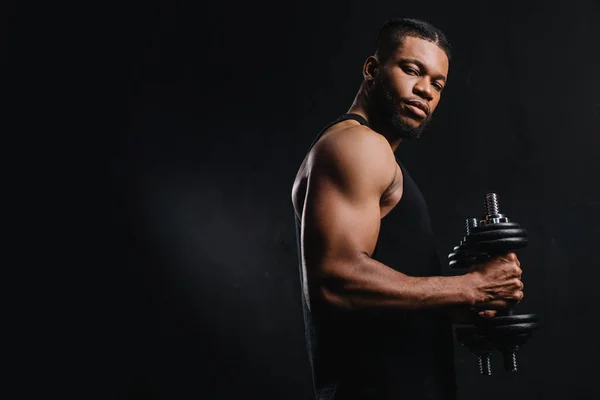 Muscular African American Sportsman Holding Dumbbells Looking Camera Isolated Black — Stock Photo, Image