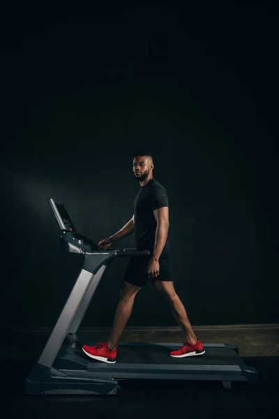 Young African American Sportsman Exercising Treadmill Looking Camera Black — Stock Photo, Image