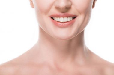 Cropped view of smiling woman with clean skin isolated on white clipart