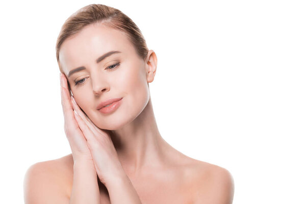 Woman with clean fresh skin touching own face isolated on white