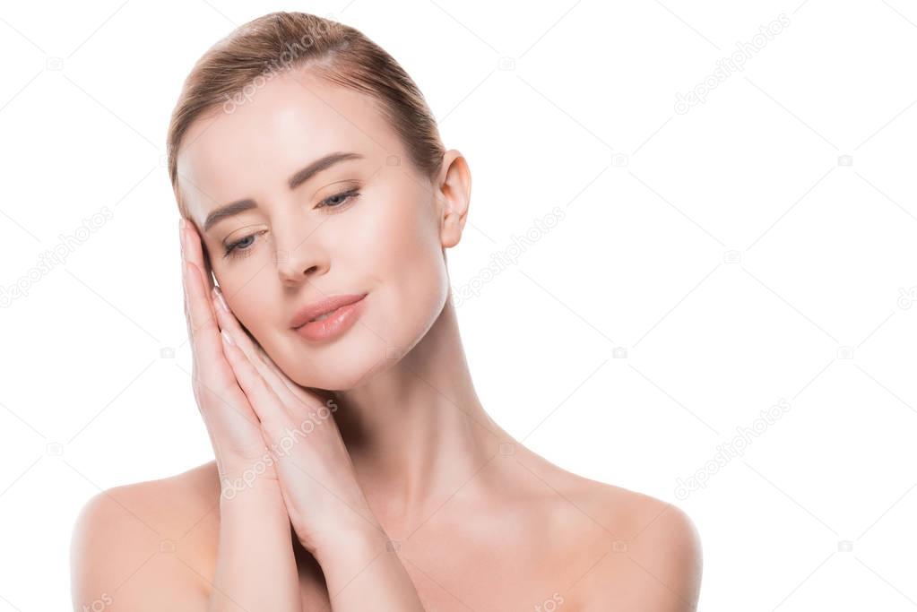 Woman with clean fresh skin touching own face isolated on white