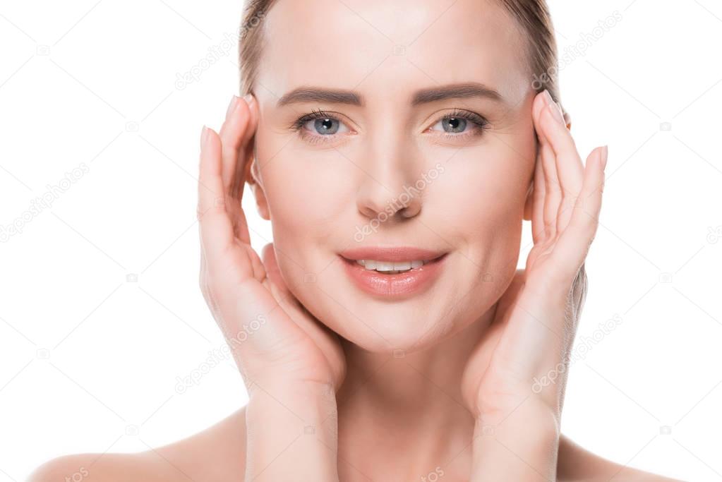 Female with fresh clean skin touching own face isolated on white