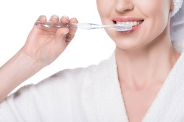 Cropped view of woman brushing teeth isolated on white clipart