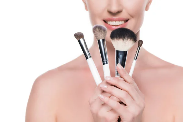 Cropped view of woman with clean skin holding cosmetic brushes isolated on white — Stock Image Cropped View Woman Clean Skin Holding Cosmetic Brushes Isolated White Stock Image