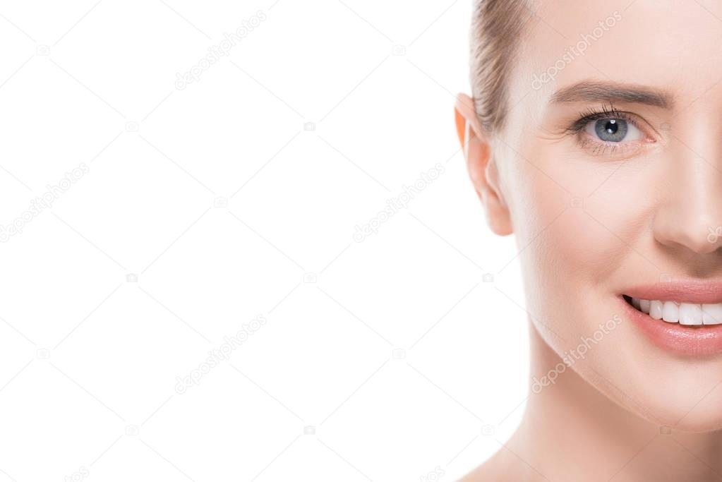 Cropped image of smiling woman with clean skin isolated on white