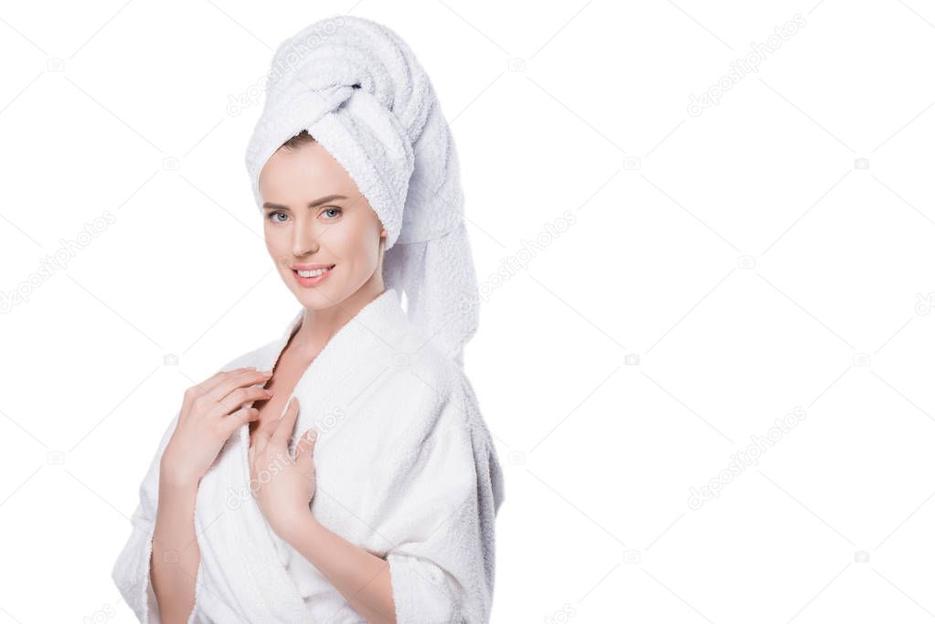 Female with clean skin in bathrobe and towel on hair isolated on white