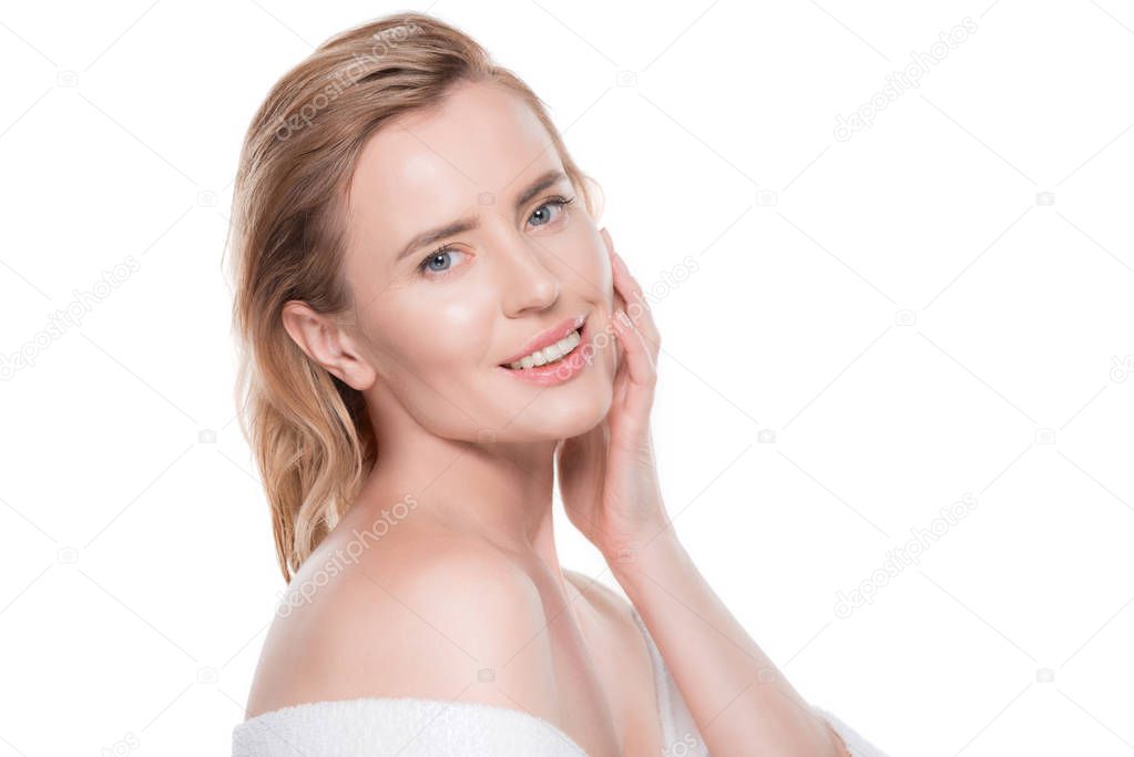 Woman with clean skin touching own face isolated on white