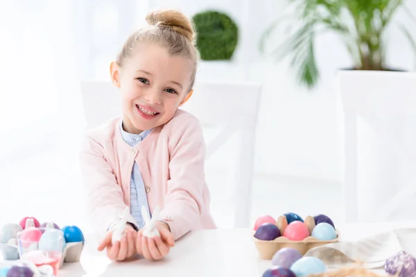 Kid Girl Showing Bunny Statuettes Easter Eggs — Stock Photo, Image