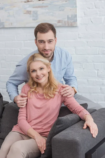 Portrait Grown Son Hugging Smiling Mother Sofa Home — Stock Photo, Image