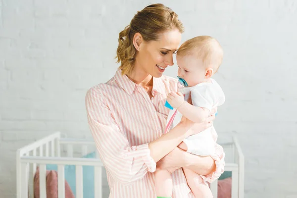 Young Mother Holding Infant Daughter Baby Dummy — Stock Photo, Image