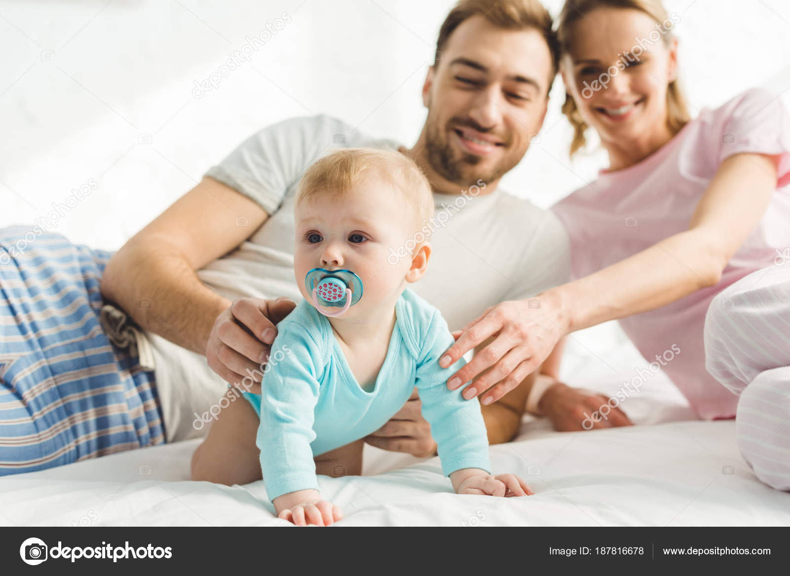 Smiling Parents Touching Infant Daughter Baby Dummy Stock Photo By C Allaserebrina