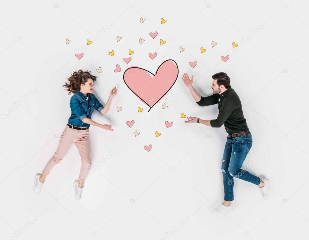 creative hand drawn collage with couple reaching for heart sign