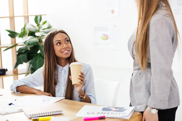 Partial View African American Businesswoman Coffee Looking Colleague Workplace Office — Free Stock Photo