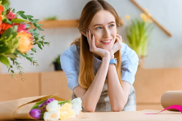 Beautiful Dreamy Young Florist Smiling Looking Away Flower Shop — Stock Photo, Image