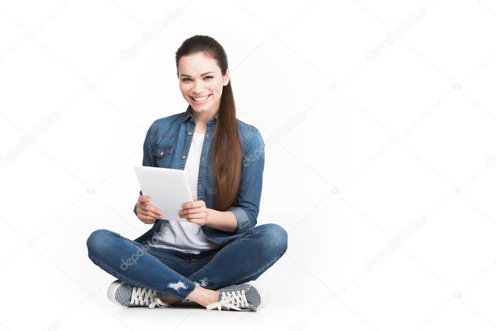 beautiful cheerful girl using tablet, isolated on white