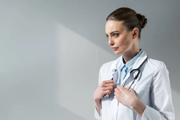 Beautiful Female Doctor Stethoscope Hanging Neck Looking Away Grey — Stock Photo, Image