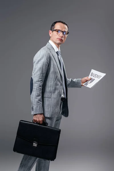 Handsome Adult Businessman Briefcase Newspaper Looking Camera Grey — Stock Photo, Image