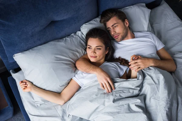 Smiling Couple Tenderly Embracing While Lying Bed — Stock Photo, Image