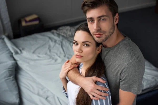 Young Man Embracing His Attractive Wife — Stock Photo, Image