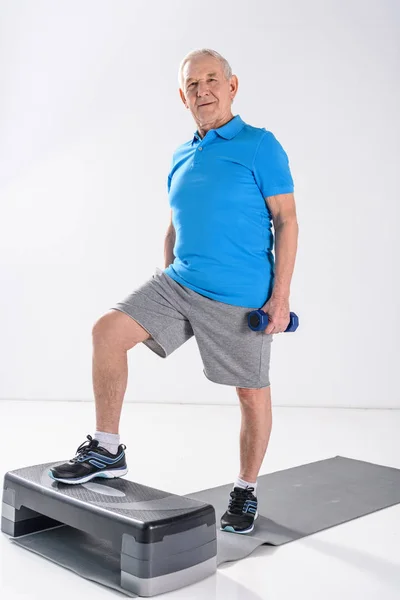 Senior Man Dumbbells Exercising Stepper Isolated Grey — Stock Photo, Image