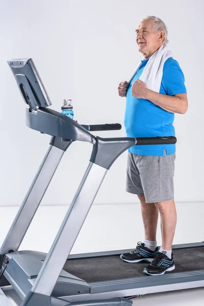 Side View Senior Man Towel Standing Treadmill Grey Backdrop — Stock Photo, Image