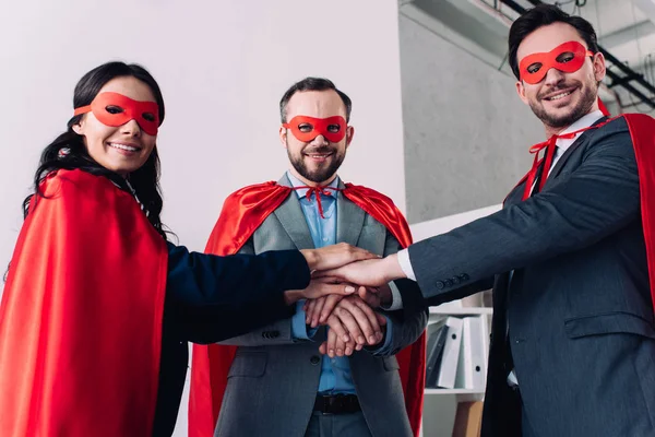 Super Businesspeople Masks Capes Putting Hands Together Office — Stock Photo, Image