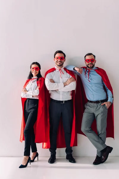 Smiling Super Businesspeople Masks Capes Looking Camera White — Stock Photo, Image