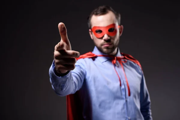 Handsome Super Businessman Mask Cape Pointing Camera Isolated Black — Free Stock Photo