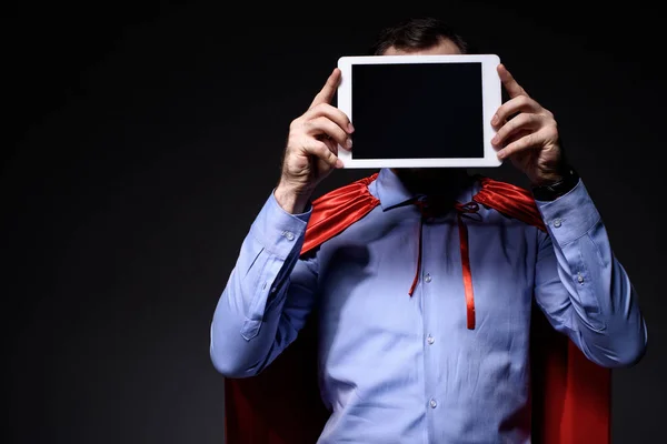 Super Businessman Cape Covering Face Tablet Isolated Black — Free Stock Photo