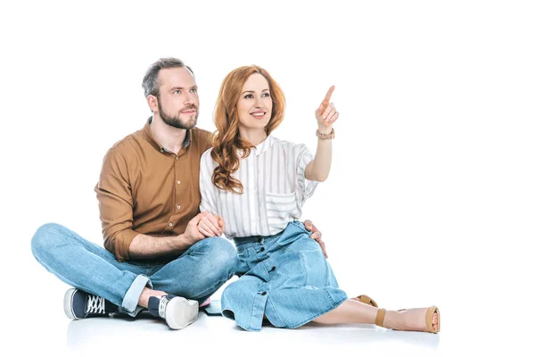 Happy Couple Sitting Together Pointing Away Finger Isolated White — Stock Photo, Image