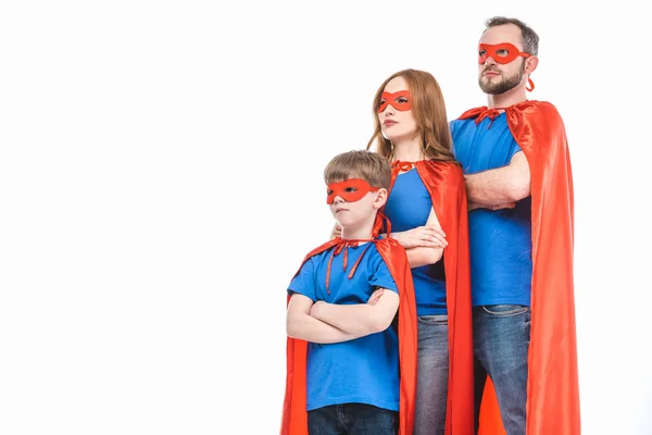 super family in masks and cloaks standing with crossed arms and looking away isolated on white