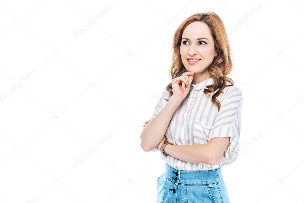portrait of beautiful smiling woman standing with hand on chin and looking away isolated on white