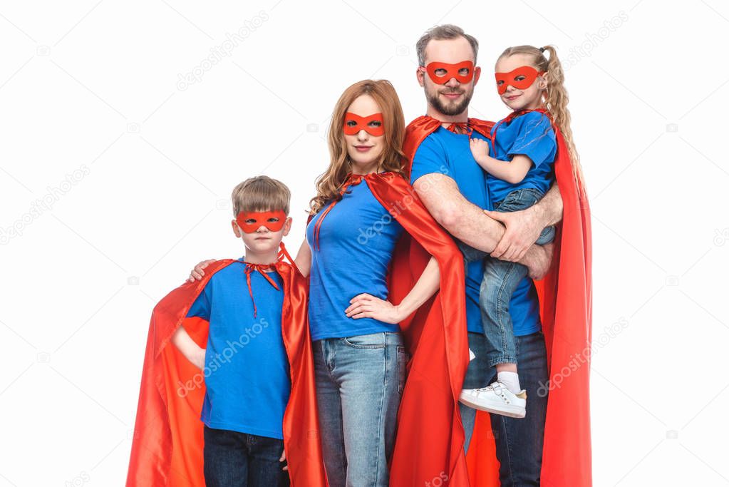 super family in masks and cloaks looking at camera isolated on white 