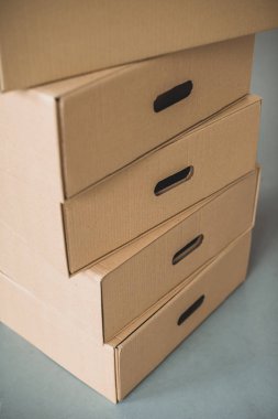 close up view of cardboard boxes in room clipart