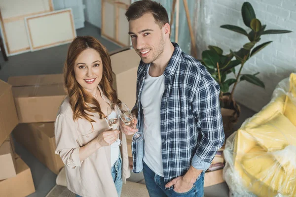 Couple Holding Glasses Champagne Smiling Camera While Celebrating Relocation — Stock Photo, Image