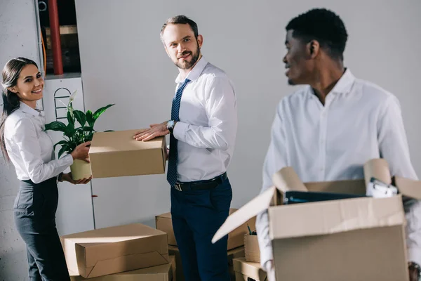 Young African American Businessman Holding Cardboard Box Looking Smiling Colleagues — Stock Photo, Image