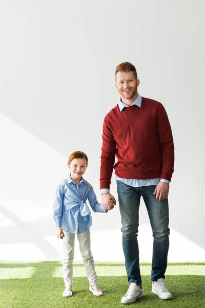 Happy Redhead Father Daughter Holding Hands Smiling Camera Grey — Stock Photo, Image