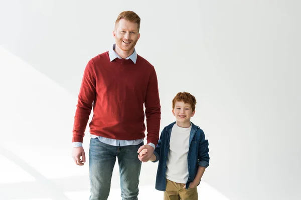 Happy Redhead Father Son Holding Hands Smiling Camera Grey — Stock Photo, Image