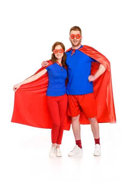 Super Couple Masks Cloaks Standing Together Smiling Camera Isolated White — Free Stock Photo