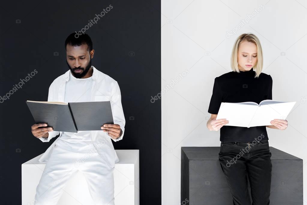 multicultural couple reading black and white books, yin yang concept