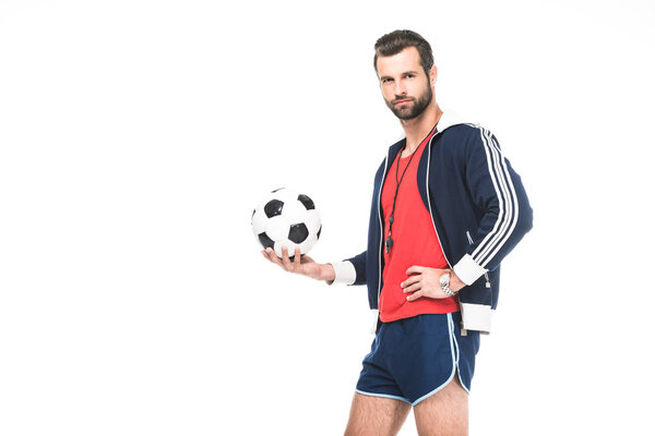 bearded soccer trainer holding ball, isolated on white