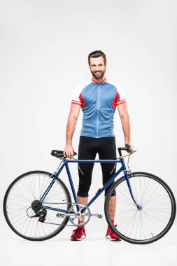 spor giyim üzerine beyaz izole model motorun poz yakışıklı neşeli bisikletçi