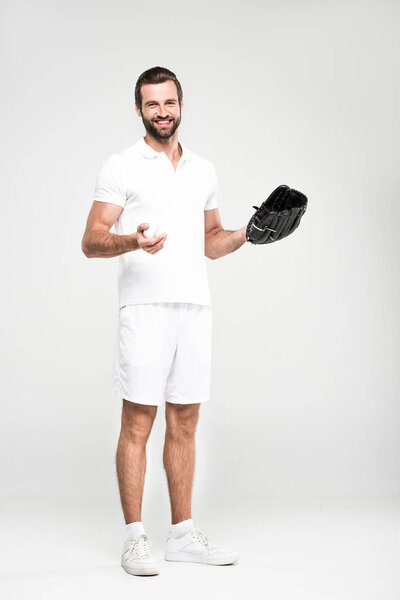 bearded baseball player with baseball mitt and ball, isolated on grey