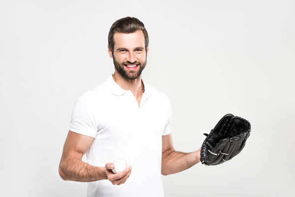 smiling bearded sportsman with baseball mitt and ball, isolated on grey