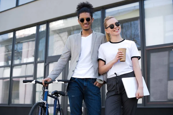 Cheerful Young Multiethnic Couple Standing Laptop Coffee Bicycle Street — Stock Photo, Image