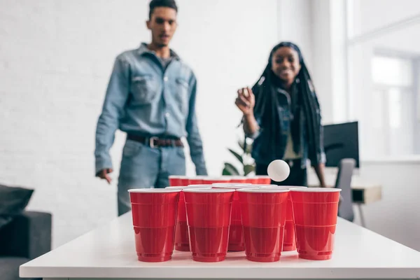 Closeup Shot Ball Flying Plastic Cup Beer Pong Game Young — Stock Photo, Image