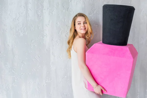 Beautiful Smiling Girl Posing Holding Big Pink Nail Polish — Stock Photo, Image